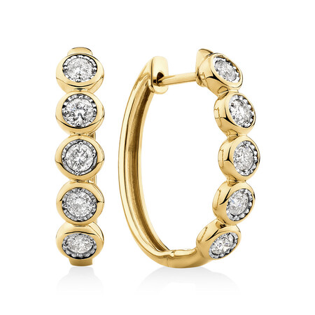 Huggie Earrings with 1/2 Carat TW of Diamonds in 10kt Yellow Gold Huggie Earrings with 1/2 Carat TW of Diamonds in 10kt Yellow Gold