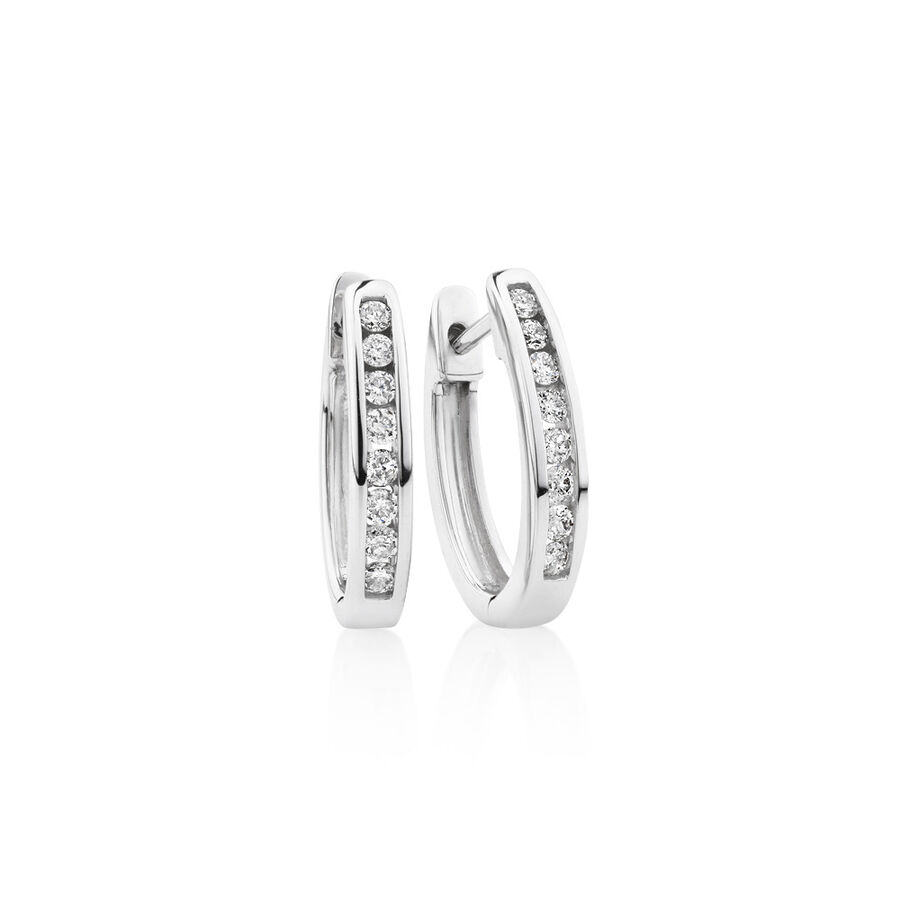 Oval Huggie Earrings with 0.25 Carat TW of Diamonds in 10ct White Gold