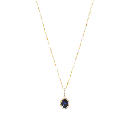 Oval Halo Pendant with Sapphire & 019 Carat TW of Diamonds in 14kt Yellow Gold