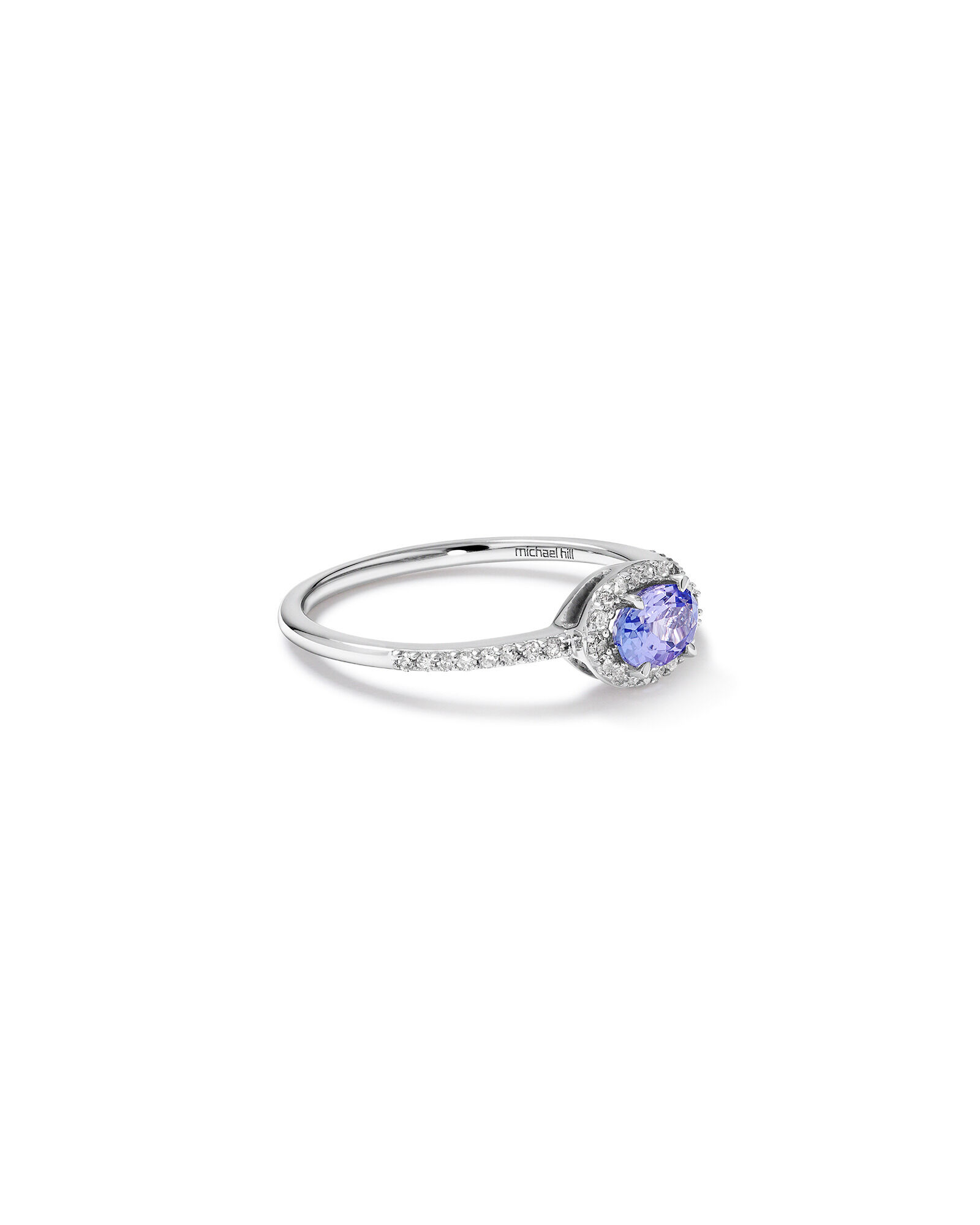Halo Ring with Tanzanite 0.15 Carat TW Of Diamonds in 10kt White Gold