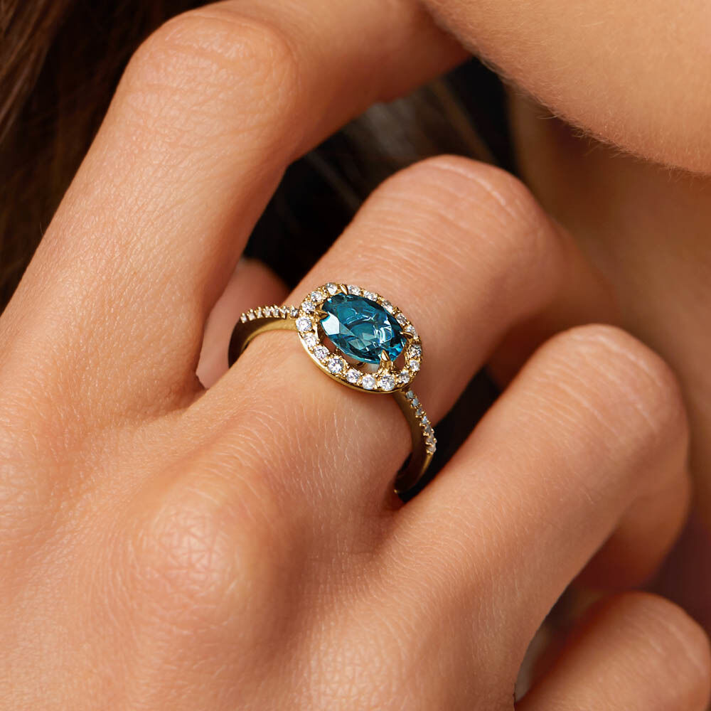 Halo Ring with London Blue Topaz 0.25 Carat TW of Diamonds in
