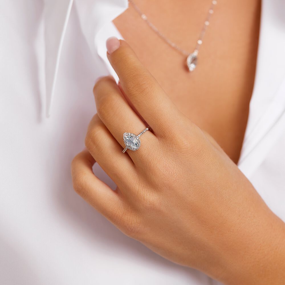 Halo Ring with Aquamarine 0.29 Carat TW of Diamonds in 10kt