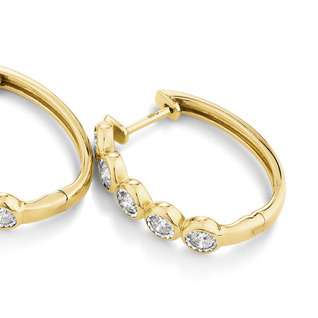 Huggie Earrings with 1/2 Carat TW of Diamonds in 10kt Yellow Gold Huggie Earrings with 1/2 Carat TW of Diamonds in 10kt Yellow Gold
