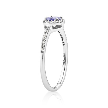 Halo Ring with Tanzanite & 0.15 Carat TW Of Diamonds in 10kt White Gold Halo Ring with Tanzanite & 0.15 Carat TW Of Diamonds in 10kt White Gold